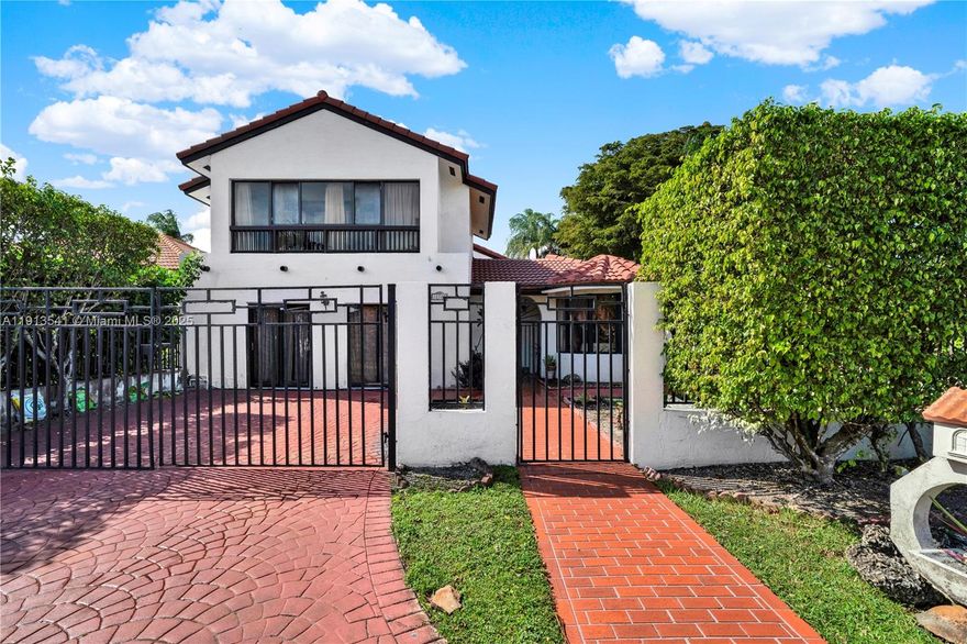 Welcome to this exquisite two-story corner unit, offering unparalleled versatility and luxury. This home can be configured as a spacious five-bedroom, four-bathroom residence, or as a four-bedroom, three-bathroom home with a completely independent in-law quarter, featuring its own living room, kitchen, bedroom, and bathroom.
As you step inside, you’ll be greeted by a grand living room with expansive windows that flood the space with natural light and offer a beautiful view from the second floor. The formal kitchen is a chef’s dream, complete with a charming breakfast nook, while the formal dining and living rooms provide elegant spaces for entertaining. Plus, a wet bar adds a touch of sophistication.