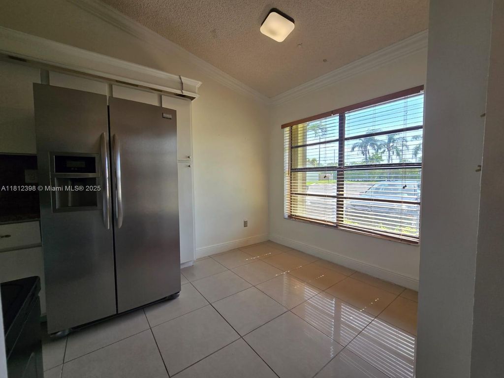 Photo of 1120 Parkside Green Dr #A, Green Acres, FL 33415 (MLS # A11812398)