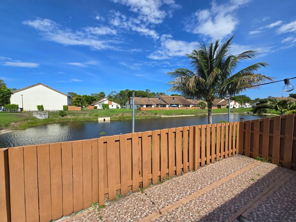 Photo of 1120 Parkside Green Dr #A, Green Acres, FL 33415 (MLS # A11812398)