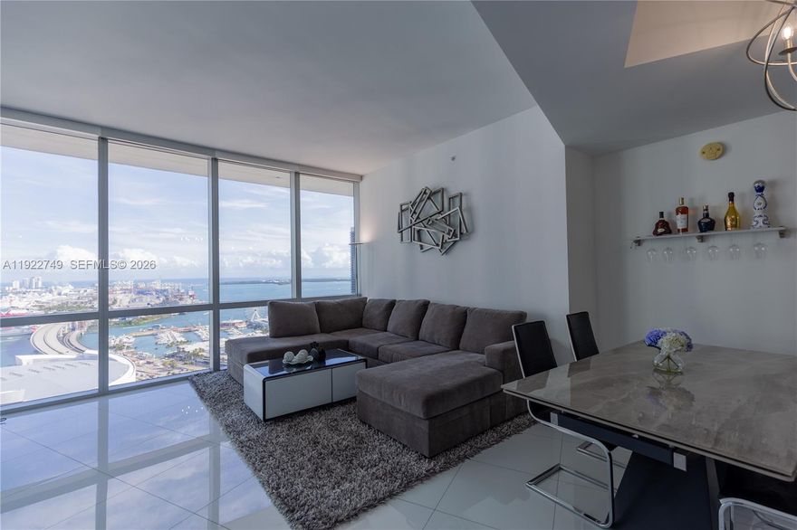 Experience elevated luxury living at Paramount Miami Worldcenter! This spectacular 2-bedroom, 3-bathroom plus Den on 33rd floor residence offers 10 ft floor-to-ceiling impact glass windows that flood the space with natural light and showcase breathtaking panoramic views of the Bay, Intracoastal, and Miami Skyline. A private elevator opens into your own foyer, leading to a spacious split-bedroom layout with a versatile Den. The European-style kitchen boasts custom cabinetry, a waterfall-edge island, and top-of-the-line Subzero/Bosch appliances. Both bedrooms feature custom built-out closets, while the primary suite includes a spa-inspired bath with dual vanities, soaking tub, and separate glass-enclosed shower. Enjoy resort-style amenities: 5 pools, spa, outdoor lounge, summer kitchen, state-of-the-art fitness center, boxing studio, yoga, racquetball, basketball court, observatory, jam room, recording studio, kids’ room, virtual golf, soccer field, sky deck, and rooftop pool, plus 24-hour front desk and valet. Situated in the vibrant Miami World Center, where you will find endless dining, shopping, and entertainment, 2nd largest master-planned community in the U.S., you’re just steps from the Brightline Station, Port of Miami, Kaseya Center, Bayside, and minutes to MIA Airport, Wynwood, Brickell, Midtown, Miami Beach and more. Can be rented up to 4 times per year, offering exceptional flexibility for end-users and investors alike.