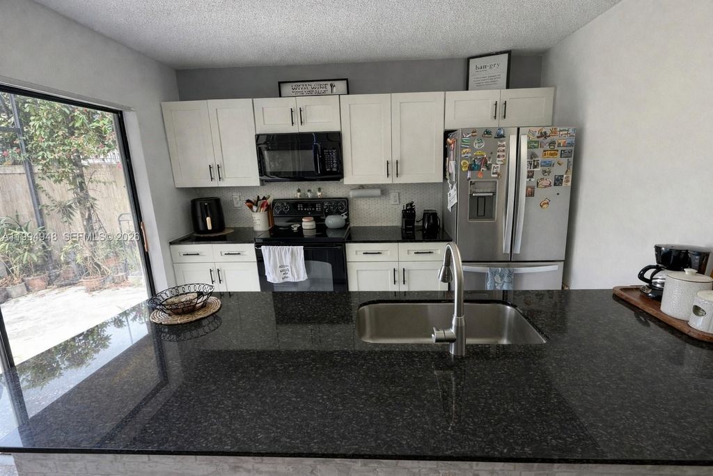 Photo of 6925 69th Way, West Palm Beach, FL 33407 (MLS # A11994948)