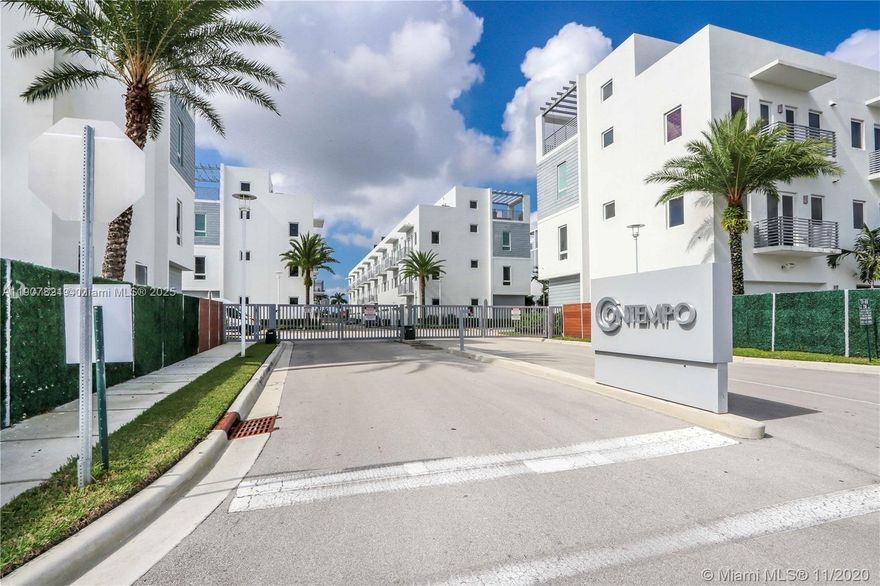 Contemporary townhome, 4 bedroom, 3 1.2 bathroom, roof terrace with summer kitchen, two-car garage and a great location.