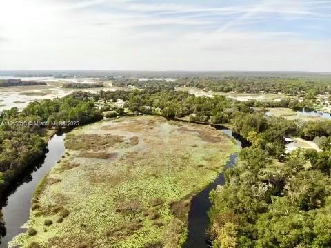 This stunning 11,172-square-foot parcel of land is nestled in the serene and beautiful growing city of Hernando, offering a perfect escape from the hustle and bustle of urban life. This property is surrounded by lush nature and boasts breathtaking views of a tranquil lake, that connects to a popular Apopka lake where you can enjoy boats and kayaks. This exceptional land for sale provides an idyllic backdrop for your dream home or investment opportunity. With established access roads, reaching this slice of paradise is convenient, making it an ideal location for those seeking peace and tranquility without sacrificing accessibility.