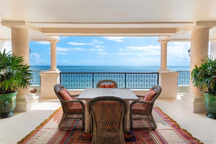 This stunning oceanside lower penthouse offers million-dollar direct ocean views. Enjoy the breathtaking Miami skyline, oceanfront views, and golf course views from every room and balcony. Boasting 5 bedrooms, 5 bathrooms, and 1 half bath, this 6,170 square foot residence offers custom features throughout. Intricate design details include a remarkable fireplace, exposed wooden beams, and custom carved wooden doors in the living room. Gourmet kitchen that features top-of-the-line Wolf and Miele appliances including a Wolf induction burner. Includes two covered garage parking spots and golf cart parking space. Wake up in your principal suite with sensational ocean views, dual closets and a private balcony. Live the ocean front lifestyle dream of Fisher Island.