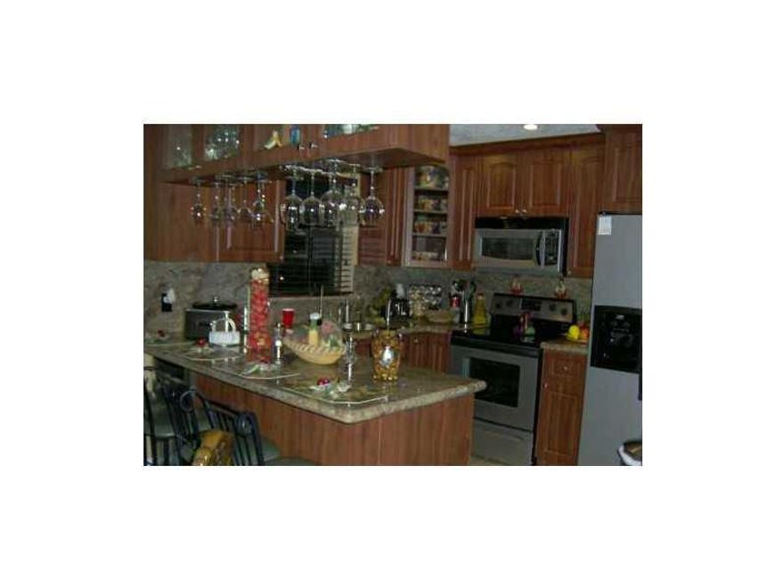 BEAUTIFUL TOWNHOUSE CONDO TOTALY REMODEL, GRANITE KITCHEN AND BATHROOM , PORCELINE TITLE THROUGHOUT, HAS A HUGE  BALCONY BY THE MASTERROOM. KITCHEN HAS A BEAUTIFUL BAR WITH WINE CELLAR, ALSO HAS TWO  WALK-IN CLOSET.