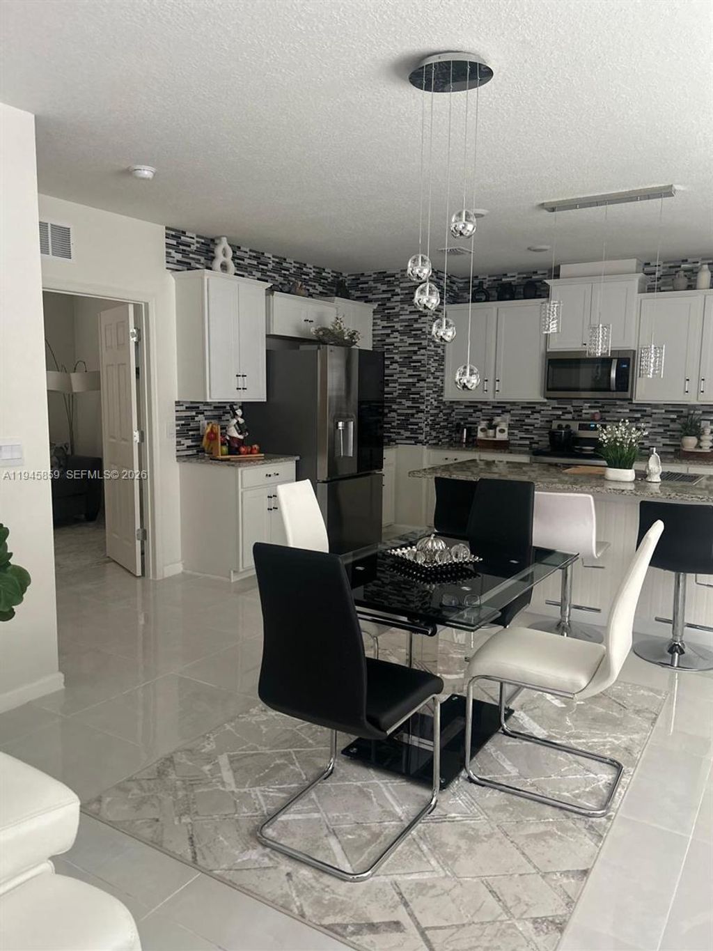 Photo of 12422 SW Rimini Way, Port St Lucie, FL 34987 (MLS # A11945859)