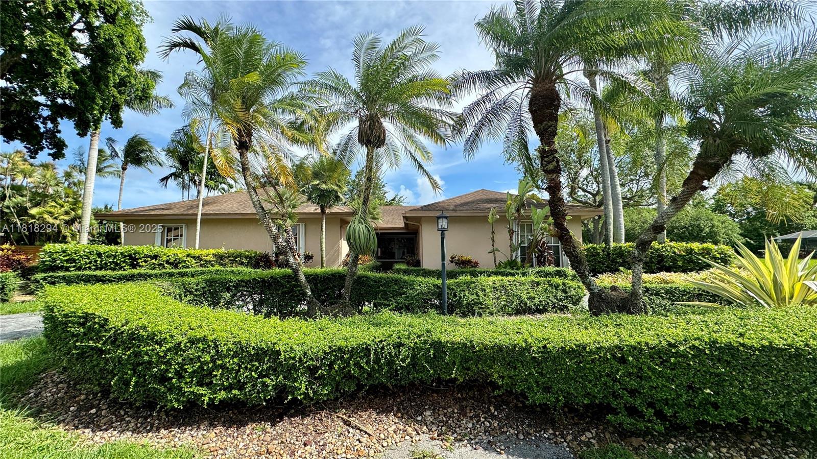 Beautiful property is nestled on a spacious corner lot in highly desirable The Falls neighborhood and situated just minutes from fine dining, great schools, shopping centers and major highways. Home features 4 bedrooms and 2 bathrooms, 2 car garage, circular driveway, family room, French doors, large living and dining overlooking the pool area, and a spacious eat-in kitchen with a nice view of the pool as well. Large covered, screened in patio and pool, 2 car garage, and a beautiful and large backyard with plenty of room for kids and completely fenced in for privacy. Great school district: Leewood Elementary, Palmetto Middle and Killian High. Must see! Please call listing agent for showing instructions.