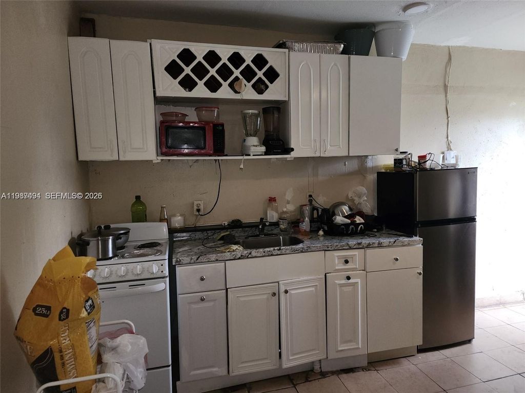 Photo of 4795 NW 42nd St #C, Lauderdale Lakes, FL 33319 (MLS # A11987494)