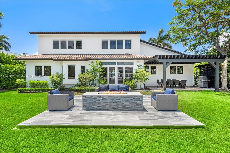 MAGNIFICENT WATERFRONT ESTATE LOCATED IN HIGHLY DESIRABLE GATED GOLDEN ISLES. THIS SPECTACULAR RESIDENCE FEATURES A BEAUTIFUL POOL & GARDENS, STUNNING FIRE PIT AND PERGOLA OVERLOOKING THE WATER. THIS HOME IS AN ENTERTAINER'S DREAM! EXPANSIVE SITTING AREAS, FORMAL DINING ROOM, LARGE DRIVEWAY AND LUSH GARDENS THROUGHOUT, COMPLETELY REDESIGNED AND UPGRADED, PERFECT FOR A PRIMARY RESIDENCE OR VACATION HOME. THIS HOME IS ALSO IDEAL FOR SHORT TERM RENTAL, IT HAS A TRANSFERABLE VACATION LICENSE. THIS AREA HAS MANY RESTAURANTS AND SHOPS AND NEAR THE BEACH. GOLDEN ISLES RESIDENTS HAVE THEIR OWN PRIVATE TENNIS COURTS/ PICKLE BALL COURTS, BASKETBALL COURTS AND PLAYGROUND AREA FOR RESIDENTS.