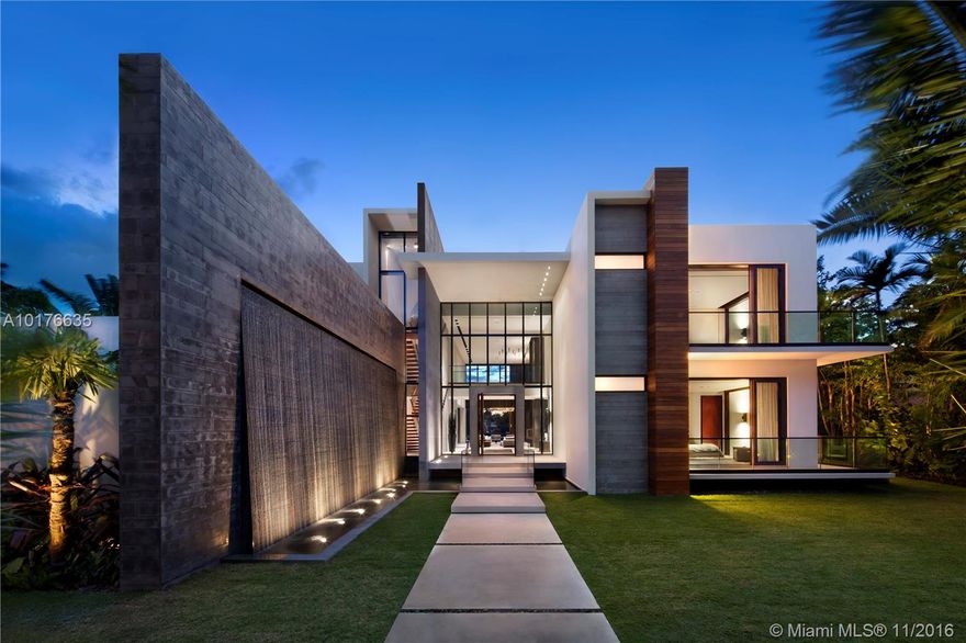 Distinctive design executed flawlessly. With an uninterrupted view of Biscayne bay & the downtown Miami skyline, it is the perfect place to enjoy the vibrant sunsets.  Architecturally significant, this property boasts 7 beds, 9 baths, 2 half baths, 11,500 square feet, 120 feet of water frontage and a full limestone deck. Interiors are integrated with exteriors through large glass doors that disappear when open. Custom Henge furniture, Boffi kitchen and Kreon lighting shows the homes individual palate.