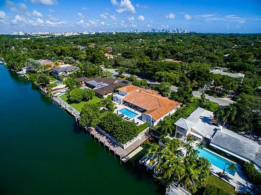 With 125 ft. of water frontage and 2 boat slips, this fully remodeled 6BR/6BA gem is perfectly situated along the Coral Gables Waterway. French doors line the back of the home while views of the canal and open spaces come together to create a bright, airy , and welcoming atmosphere. The exquisite custom kitchen features top-of-the-line Miele and Sub-Zero appliances along with quartz countertops. Ceramic tile floors are used throughout the home while the bedrooms all contain beautiful dark hardwood floors.