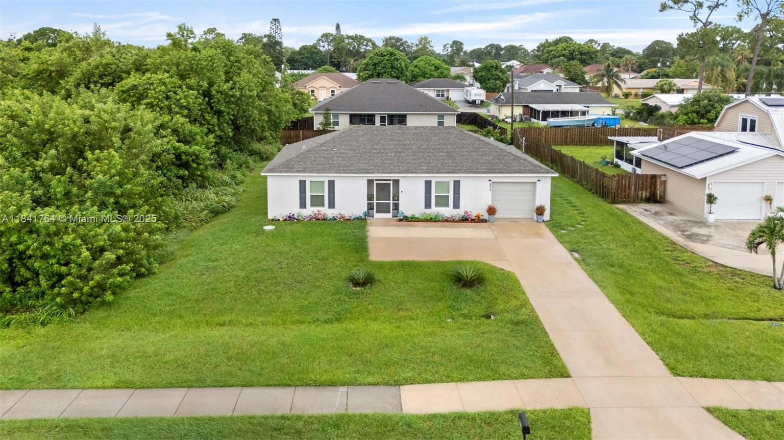 Welcome to this nearly new 3-bedroom, 2-bathroom home, built in 2023 and located in the heart of Port St. Lucie! This move-in-ready property features a bright, open-concept layout with a modern kitchen featuring stainless steel appliances and tons of counterspace. The spacious primary suite offers a walk-in closet and en-suite bath with sleek, updated finishes. Enjoy outdoor living with an oversized backyard with lots of room for a pool and more—perfect for entertaining or relaxing. Conveniently located near shopping, dining, schools, and major highways. No HOA. Don't miss this opportunity to own this like new home in a prime location!