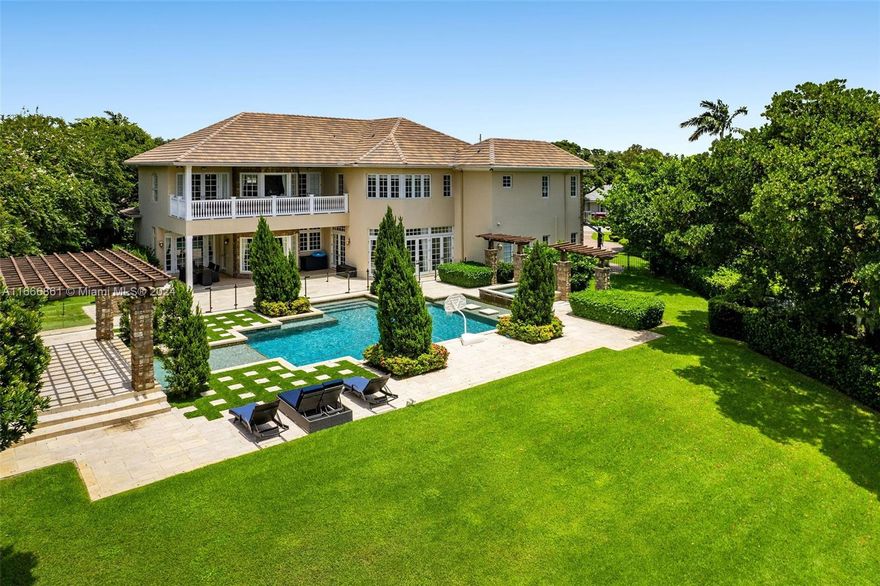 Experience a once-in-a-lifetime opportunity in the coveted Emerald Hills neighborhood with this expansive estate. Situated on a .5-acre lot, this property boasts over 7,000 sq. ft. of living space, 6 bedrooms, and 5.5 bathrooms. Built in 2009, it blends modern luxury with timeless charm, featuring generous living areas and breathtaking views. Upon entry, double-height ceilings create a grand atmosphere in the living room. The formal dining area is perfect for entertaining, and the expansive kitchen with a breakfast nook overlooks a serene lake. The primary bedroom is a luxurious retreat with a spacious walk-in closet, office area, separate his and her bathrooms, and a balcony with stunning lake views. Outside, enjoy a beautiful pool with a waterfall feature and incredible lake views.