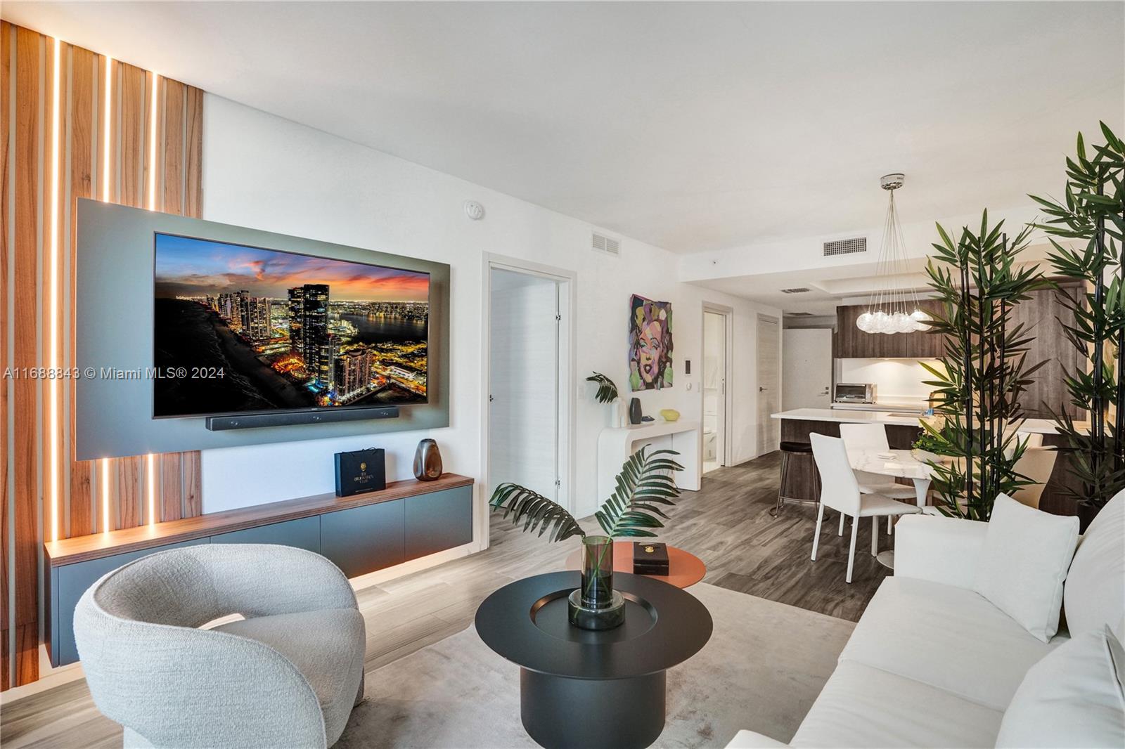 This 1 bed, 2 full bath + Den unit has been upgraded with a $30K CUSTOM WALK-IN CLOSET, a custom living room tv console with lighting, remote controlled shades, elegant white marble bathrooms, high end kitchen appliances, an office space to work from home, private elevator and foyer to the unit. Amenities include a rooftop pool & jacuzzi, a second pool deck with a full bar, cabanas, tennis/basketball courts, fitness center and spa, valet service for your car, and 24 hr concierge/security. Brickell City Center, Mary Brickell Village, Sugar, Gekko, and River Oyster Bar are all at your doorstep! Furniture and Artwork from Avant Gallery are negotiable. Schedule your appointment today