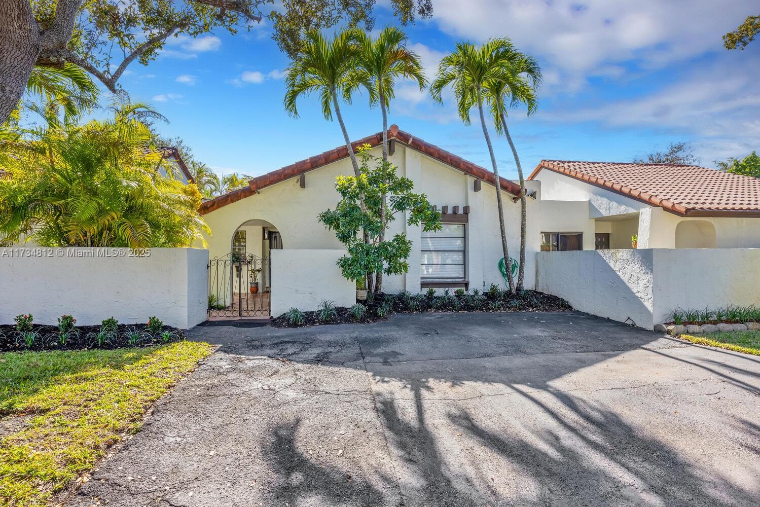 Stunning three-bedroom home in the highly desirable Town Villas community in the Crossings offers a spacious and functional layout, featuring a generously sized kitchen, large bedrooms, and a wrap-around patio perfect for entertaining. The exceptionally low maintenance fee is a remarkable value, granting access to incredible amenities like a clubhouse, Olympic-sized pool, gym, tennis/pickleball courts, and scenic walking trails. Additional highlights include a 3-car driveway, a charming front patio, and an oversized back patio, partially covered by a sleek modern aluminum roof. Ideally located near top-rated schools, shopping, Miami Executive Airport, and major highways, this home offers both comfort and convenience in an unbeatable location.