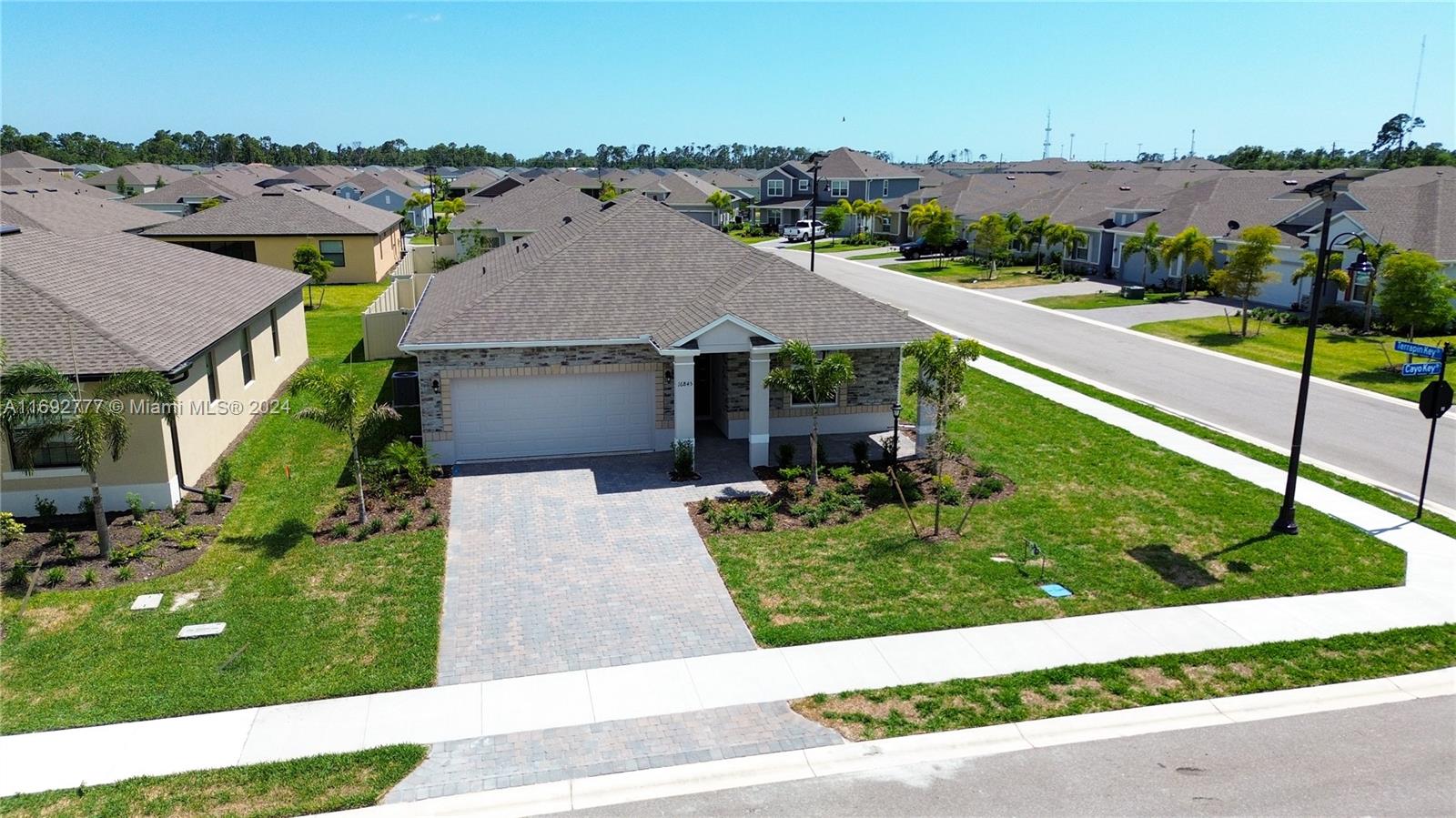 Brand New never lived in 2024 Maronda Home –3 Bed, 2 Bath on a Private Corner Lot! Located in beautiful West Port, Port Charlotte, FL, this home has a bright, open layout with recessed lighting and a cozy front porch. The kitchen includes stainless steel appliances, granite countertops, an island, and a dishwasher. The master suite offers a tray ceiling, walk-in closet, and serene ambiance. Positioned on a private corner lot, the home has a gated backyard for outdoor fun. The community includes solar-powered lighting, a playground, and a recreation center with a gym, courts, and lap pool. Enjoy trails, pickleball, and fitness classes. Close to Charlotte Sports Park home to Tampa Rays, dining, & more,this eco-friendly home blends comfort, community, and nature. Be the first to call it home!