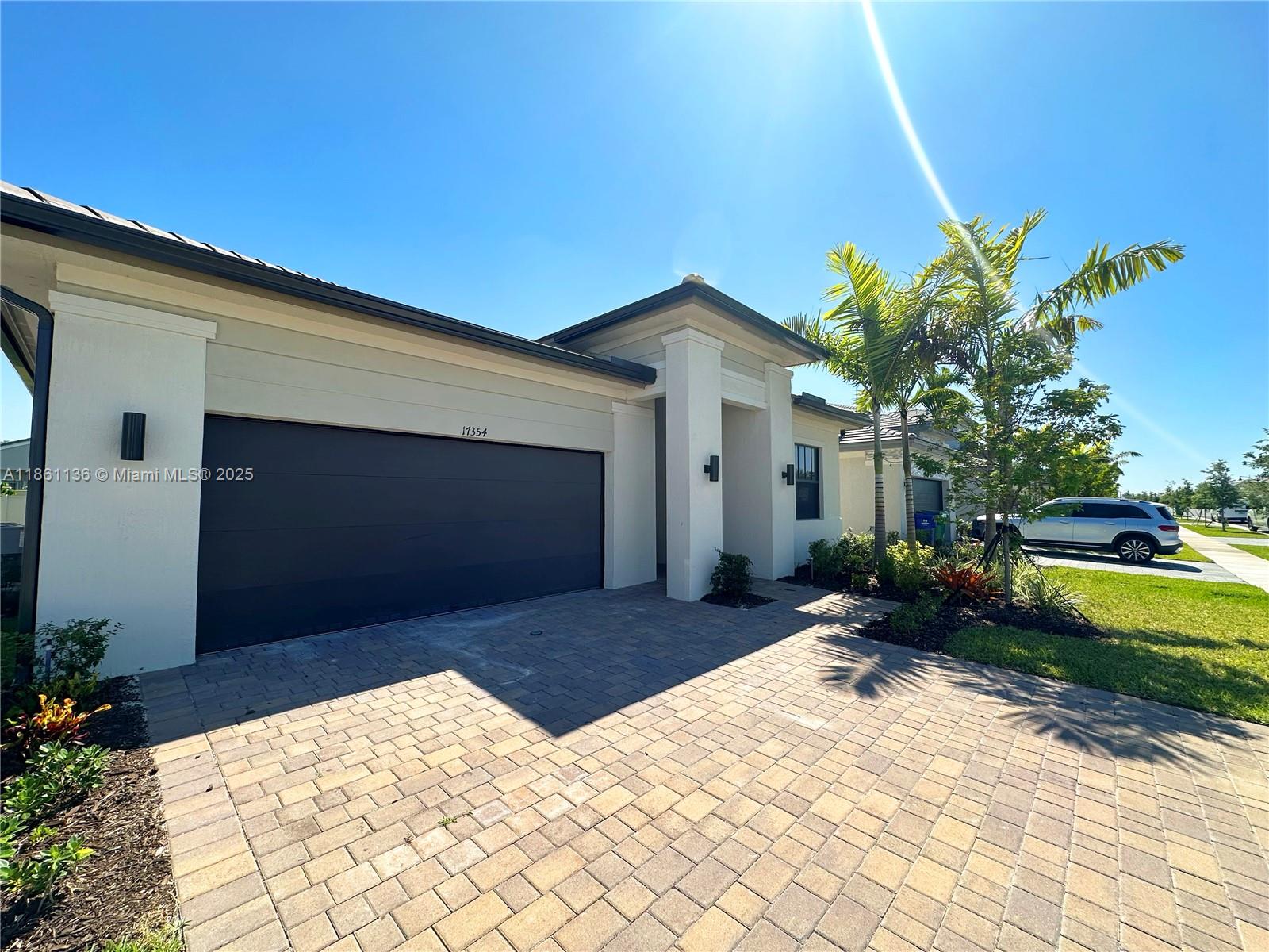 Welcome to this 5 bedroom, 3 bathroom home in the brand new neighborhood of Miramar, Marbella. Extended driveway that can hold up to 4 cars. Add that to the garages, and you've got space for a total of 6 cars! Quite comfortable, open concept living space. The home is outfitted with zebra blinds in communal areas and blackout blinds in bedrooms, so it's move-in ready. Bathrooms are equipped with all the essential accessories. Conveniently located near I-75 and pet-friendly. Schedule a showing today!