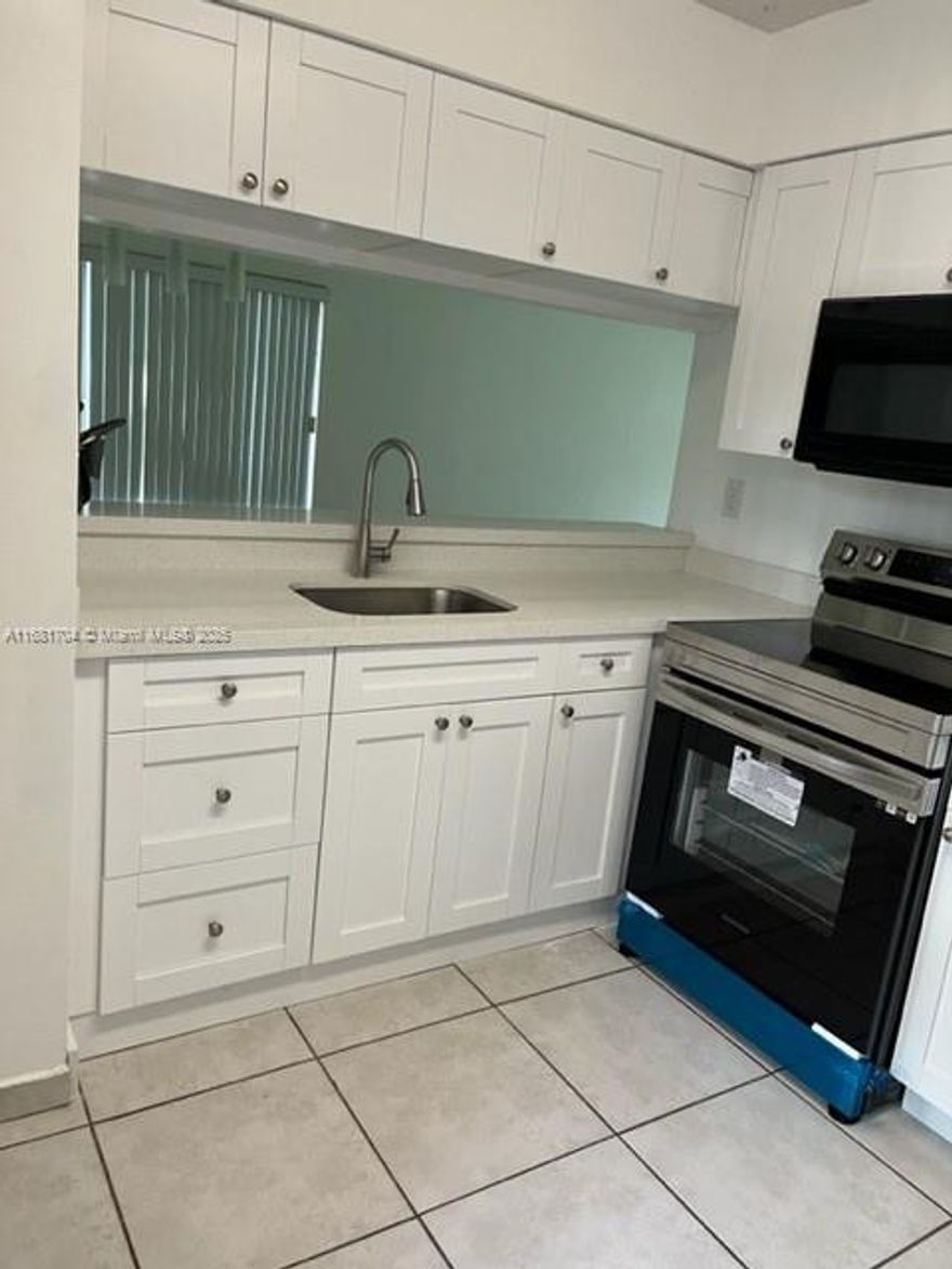 Back to the Market! Spacious condo 2 bed/2bath in a gated community.  First Floor unit. Newer kitchen cabinets with quartz tops. Newer stainless-Steel Refrigerator and Range-E. Both Bathrooms are completely renovated. Tile and laminate wood floors. Great Location at Kendall. Near Turnpike and Major Expressways, best restaurants and shopping centers. Excellent Tenant in Place. Great Opportunity for Investors.