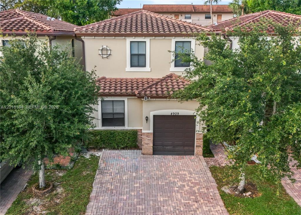Photo of 4909 NW 59th St, Tamarac, FL 33319 (MLS # A12018134)