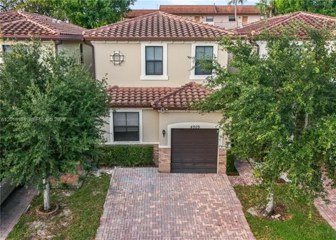 Photo of 4909 NW 59th St, Tamarac, FL 33319 (MLS # A12018134)