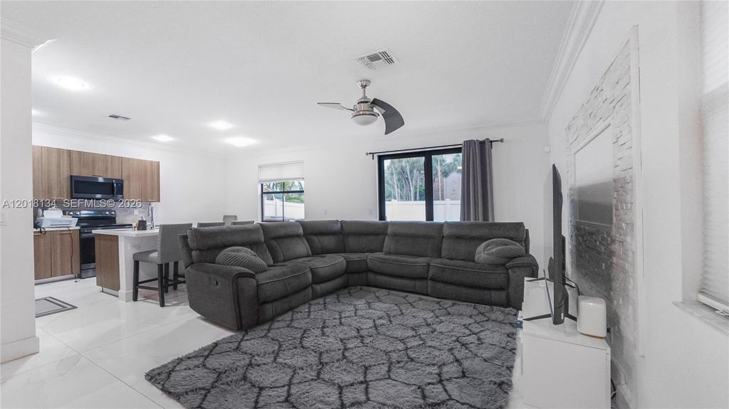 Photo of 4909 NW 59th St, Tamarac, FL 33319 (MLS # A12018134)