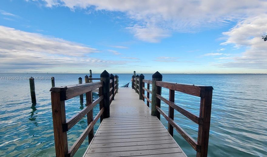 Welcome to your own slice of paradise! Enjoy breathtaking sunsets from your private dock on this waterfront property boasting 100 feet of direct Biscayne Bay frontage. Ideally located on Mashta Island. Set on a 15,000 SF lot, the home features 5 beds, 5 baths, including 2 bayfront primary suites with stunning views, impact windows and doors throughout. The open-concept layout flows seamlessly from the living and dining areas to the modern kitchen and out to the pool and entertainment patio, with floor-to-ceiling glass doors that open to blend indoor and outdoor living. Tranquil guest suite upstairs offering privacy and views. It also features an oversized 2-car garage, covered parking, and a spacious driveway for guests. Perfect to move in, renovate, or build your dream waterfront estate.