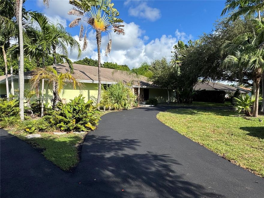 Exceptional single family 4 Bedroom, 4 Bathrooms, 2 car garage home is in the highly desirable Palmetto Bay neighborhood on an oversized cul-de-sac lot. Offering 2,593 SF of living space, the home features a large family room, living room, dramatic volume ceilings and a screened-in pool. The spacious primary suite includes a private office. Ideal for families seeking flexibility, space, and comfort. Park boat/ RV/ Golf Cart or other toys. Located minutes from Old Cutler Road, Black Point Marina, Montessori Schools and Palmer Trinity, Westminster, Palmetto High, A-Rated schools Don't miss this incredible opportunity. This property is an ideal fit for families seeking flexibility, space, and comfort in one of Miami-Dade's most sought-after neighborhoods.