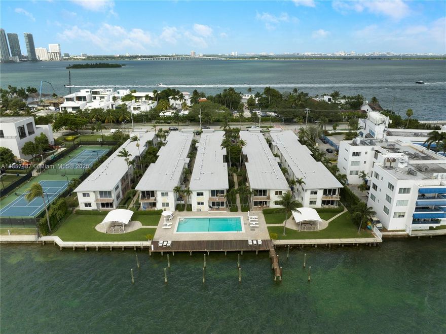 LIVE IN PARADISE. Rarely available on the Venetian Causeway! Renovated 1 bedroom and 1 bath with all new impact windows and balcony in the unique gated and quiet Sandpiper residence. The building features a beautiful bayside salted and heated pool, gorgeous landscaping, paddleboards room, lots of street parking and a Marina. Boat Lovers calling! Washer and dryer in unit and 1 storage outside the unit. Easy to show.