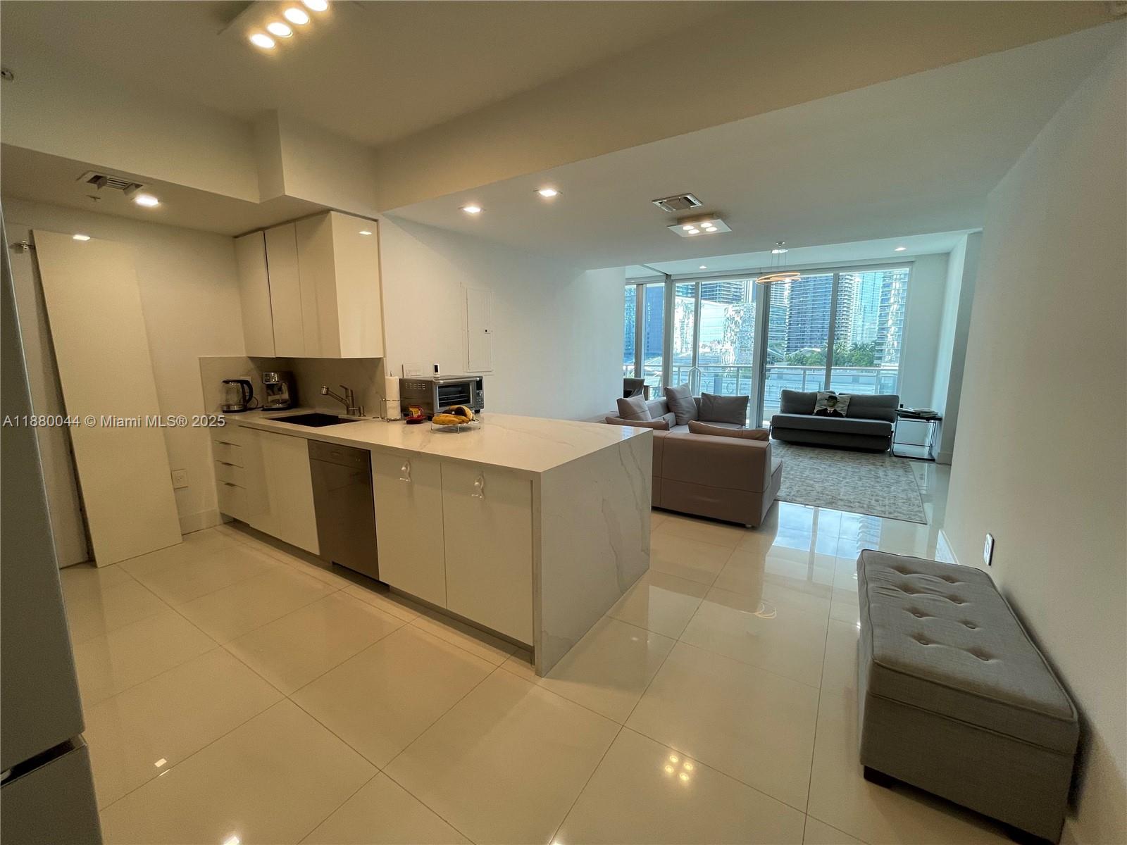 Stunningly remodeled 2 bed, 2 bath unit, showcasing exquisite taste and attention to detail throughout. Featuring high-end finishes, modern design, and an open-concept layout, this unit offers both comfort and elegance in every corner. Electric shades, new appliances, luxury bathrooms and kitchen. Show with pride this magnificent unit. Parking assigned in the 4th floor 469.