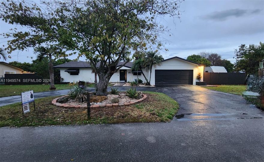 This well-maintained home offers 3 bedrooms and 2 bathrooms, including a spacious primary suite with a walk-in closet. The hallway features a convenient linen closet for extra storage, along with an additional walk-in closet as well.
The two secondary bedrooms are generously sized and can comfortably fit a full-size bed, a complete bedroom set, and a desk.
The home includes an oversized two-car garage designed for two large vehicles (not compact), featuring two storage closets and ample overhead storage to keep items organized and off the floor.
The AC system has been updated, and the kitchen has also been updated, making this home truly move-in ready.
Situated on just under half an acre, the property offers plenty of room for a boat, RV, and even a large pool. The property is RV-ready, featuring a 50-amp electrical hookup and a sewer connection.
Outdoor living is a standout feature, with a 14’ x 26’ covered terrace ideal for entertaining. The space includes a designated barbecue area, perfect for gatherings, family events, or relaxing evenings.
Additionally, the home offers a circular driveway with parking for up to six extra vehicles, plus the oversized garage—providing exceptional convenience and plenty of space for guests.