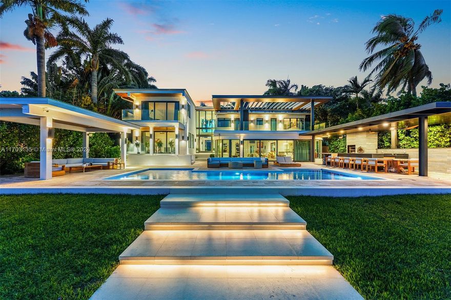 This Magnificent waterfront property on E Rivo Alto Dr. on the Venetian Islands, Miami Beach, offers 90 feet of pristine water frontage, providing breathtaking views & direct access to the beautiful waterways of Miami. The home is filled with natural light making it an amazing space for the Art Collector. Enjoy true indoor/outdoor living with an open floor plan that seamlessly connects your living spaces to the stunning outdoors & unobstructed views of Biscayne Bay. Host unforgettable gatherings with a new summer kitchen with Brazilian-style BBQ & Pizza oven, and Gas fireplaces both poolside & Dockside, creating a magical atmosphere for nighttime entertaining. The property sits on a rare Lot & a half. Car lovers can showcase their collection through the glass of the custom 4- Car Garage.