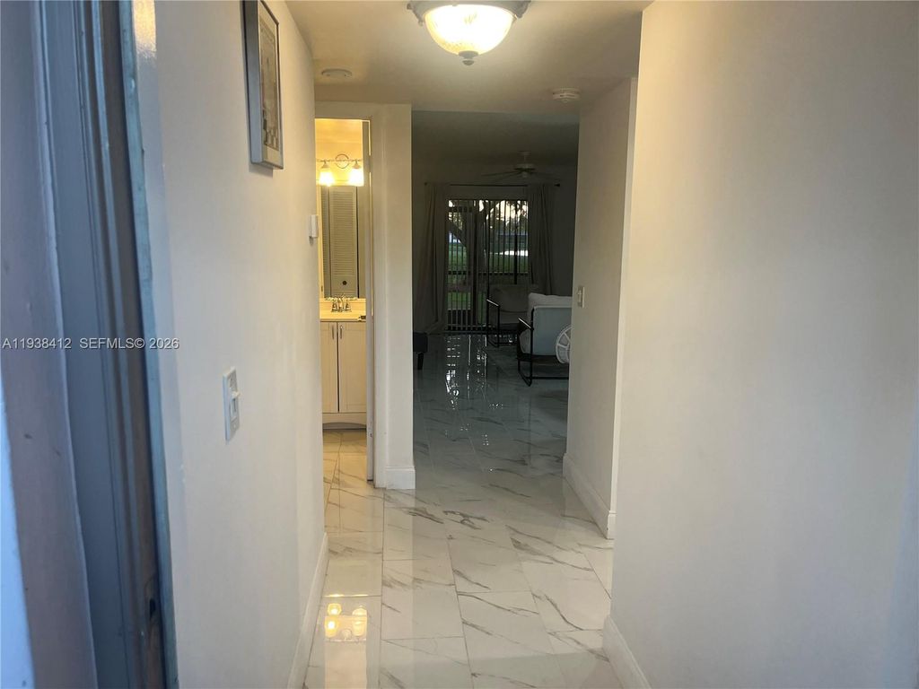 Photo of 10402 Sunrise Lakes Blvd #107, Sunrise, FL 33322 (MLS # A11938412)