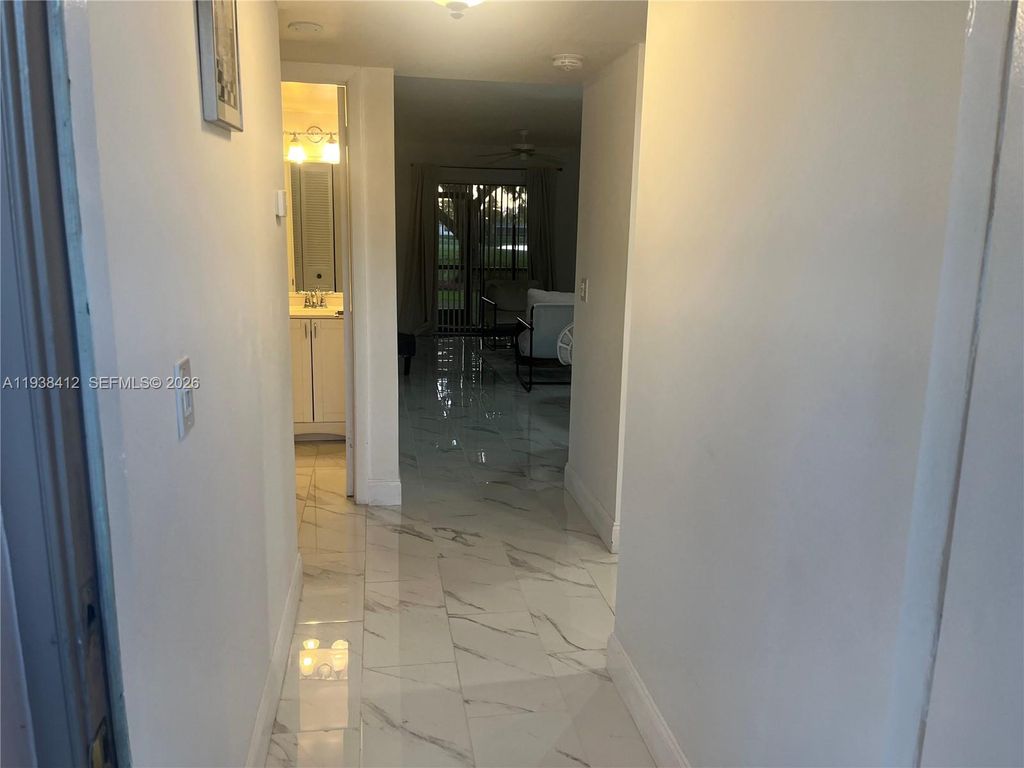 Photo of 10402 Sunrise Lakes Blvd #107, Sunrise, FL 33322 (MLS # A11938412)