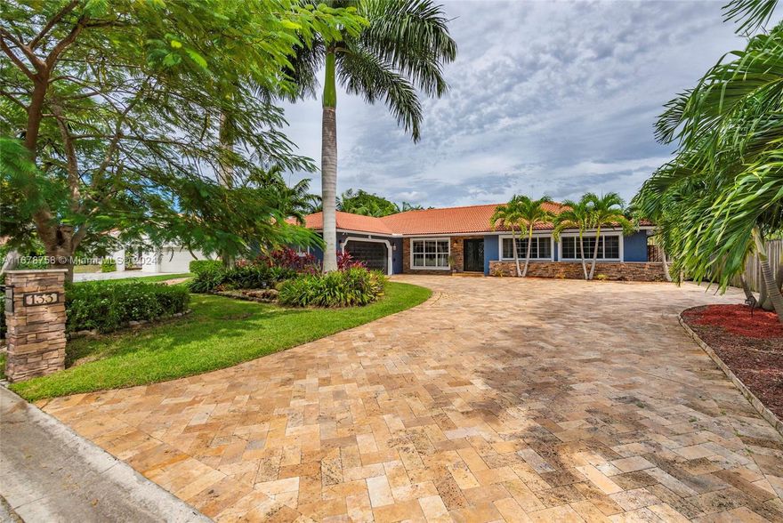 Boasting 5 bedrooms and 2.5 bathrooms this waterfront, pool home is the epitome of "Florida Living." Through elegant double doors- soaring vaulted ceilings, oversized picture windows, and both formal and informal entertaining areas greet you! A chef's kitchen featuring top-of-the-line stainless steel appliances & gorgeous granite countertops connect the family room, breakfast nook, and the outdoor patio. The spacious bedrooms are separated from the social spaces in a private corridor. The backyard is truly an "entertainer's dream" with a sparkling pool, oversized spa, outdoor kitchen, and outdoor shower. Also featured is a climate controlled clubhouse and views of “The Mountains Natural Area” a city owned riverfront nature area where your privacy and tranquility are sure to be preserved.