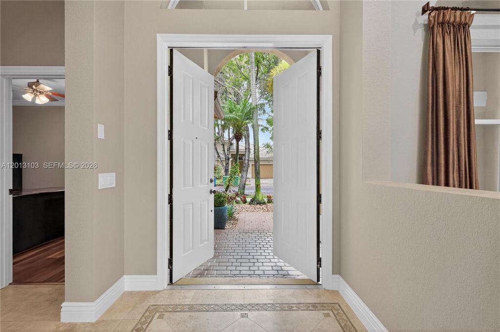 Photo of 1306 Crossbill Ct, Weston, FL 33327 (MLS # A12013103)