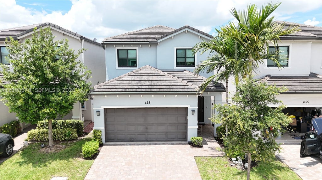 Photo of 425 NW 33rd Ln, Pompano Beach, FL 33069 (MLS # A12060078)