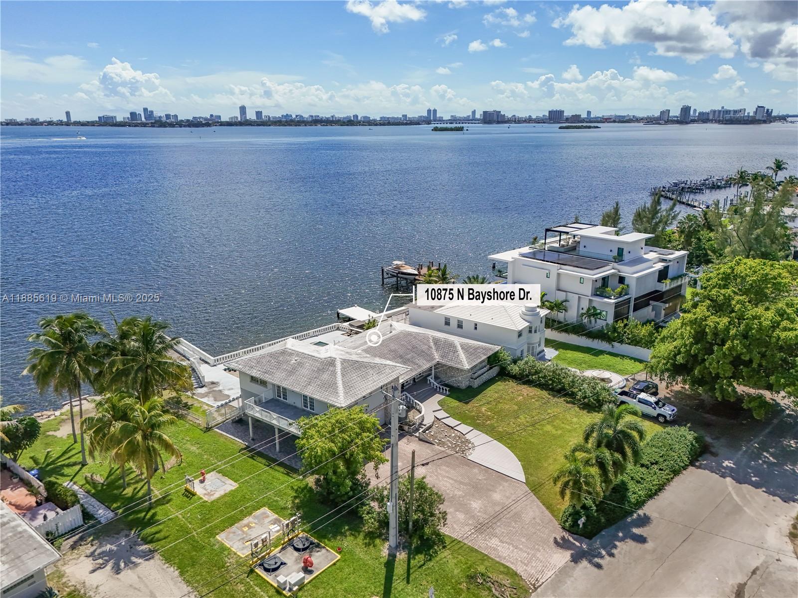 RARE BAYFRONT DEVELOPMENT OPPORTUNITY – 102 FEET ON WIDE OPEN BAY! Incredible chance to build new on a 12,765 SF lot (102x125) with panoramic bay views just 7 miles north of Downtown Miami. Surrounded by new construction in a rapidly transforming neighborhood, this oversized waterfront parcel features a solid concrete seawall, expansive dock, and large concrete deck — perfect for luxury waterfront development. The existing 5-bed, 6-bath home (5,000 SF under roof / 3,200 SF under A/C) can be remodeled or removed to make way for a custom estate. Few properties offer this scale, frontage, and open bay exposure — ideal for developers or end-users looking to create a trophy home.
