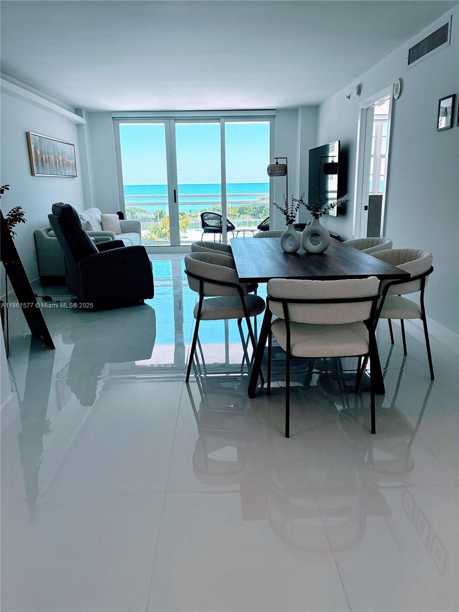 Luxury Oceanfront Living at The Collins, Experience the best of stylish, serene beachfront living in this completely remodeled, fully furnished, and fully equipped 1-bedroom, 1.5-bath luxury residence in the iconic The Collins Condominium, Located on the fourth floor, this spacious unit offers an open-concept floor plan with tile floors throughout, a Modern kitchen with top-of-the-line appliances, Elegant high-end furnishings and décor, Electric blinds, in-unit washer & dryer, and plenty of closet space and one parking spot. Enjoy your morning coffee overlooking the sparkling Atlantic! Building Includes: Direct beach access, Beachside pool & sundeck, 24/7 concierge, valet, and on-site management gym, and more Steps from restaurants, cafés, shops, banks, and Publix.