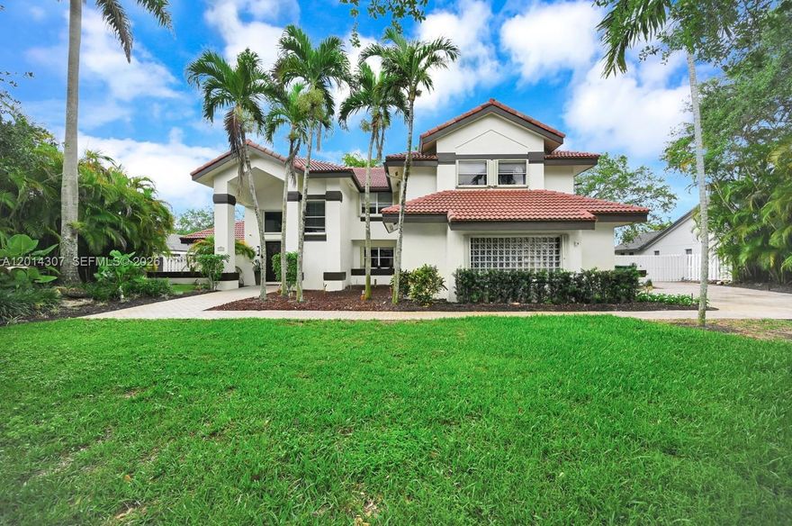 Welcome to this spacious 5-bed, 3.5-bath home nestled away on a quiet cul-de-sac in the Heart of Killian Place. Sitting on a generous 20,148 sq ft lot, this home features Grand living room with 20-ft ceilings. Formal dining and a Newly Renovated custom Wet Bar, plus a generously sized Custom Kitchen with exquisite cabinetry ideal for entertaining. Enjoy a convenient first-floor bedroom and bath, while the large upstairs Master suite offers a spa-style tub, ample custom closets, with a private balcony to pool views. The screened-in pool boasts serene waterfall features and opens to a large, shaded backyard—ideal for outdoor Entertaining and Barbeques. Just minutes from US1,Pinecrest and The Falls shopping Mall>Location offers easy access to major expressways,shopping,dining and schools.