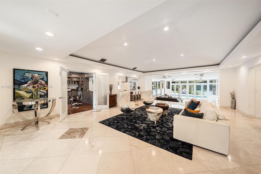 Welcome to your private oasis in North Pinecrest! This stunning one-story gated retreat spans 7,476 total sq. ft. on a lushly landscaped 50,529 sq. ft. lot, blending luxury and tranquility. The spacious 4BR/3BA main house boasts a new gourmet kitchen with Viking appliances, living room, dining room, family room, home office, and media room. Other amenities include a 1BR/1BA guest house & fitness studio w/ half bath. The expansive backyard is an entertainer's paradise, with a sparkling pool, Jacuzzi, and summer kitchen. Enjoy the lighted north/south tennis court, relax in the tiki hut, or stroll the nature trail. Additional features include a newer roof, whole-house generator, hurricane protection, 2-car garage, and 2-car carport. Experience the ultimate in luxury in your private sanctuary.