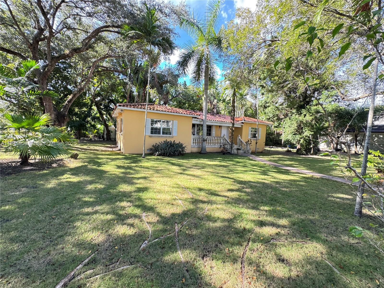 Charming single family home in Coral Gables, original features, well maintained, 3 bedrooms 2 bathrooms, hard wood flooring, 1 car garage, and driveway. Property is on a spacious 14,400 Sqft lot surrounded by lush landscaping and matured trees. Very private and secure street close to parks, excellent schools, shopping, and restaurants.