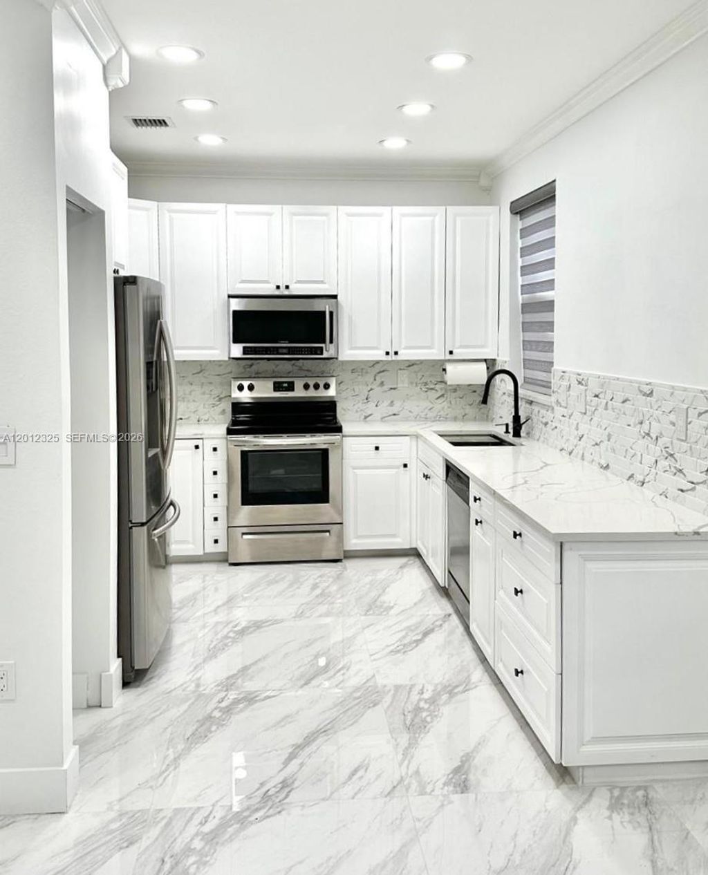 Photo of 721 NW 170th Ter #721, Pembroke Pines, FL 33028 (MLS # A12012325)
