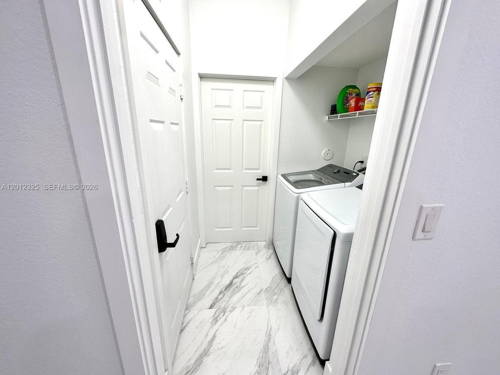 Photo of 721 NW 170th Ter #721, Pembroke Pines, FL 33028 (MLS # A12012325)