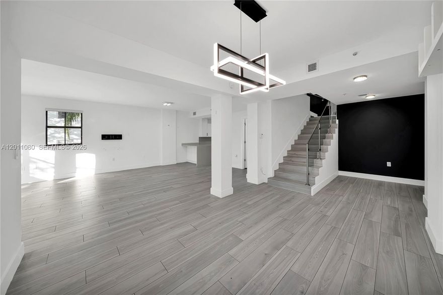 Discover this updated modern corner townhouse nestled in a boutique-style community on a picturesque, tree-lined street—just an easy 8-minute walk to Giralda Avenue and Miracle Mile. Perfectly situated across from Phillips Park, tennis courts, and Publix, this residence offers exceptional walkability and convenience right at your doorstep. Step inside to a spacious open living area featuring sleek modern finishes, including a contemporary glass stair railing. Upstairs, both bedrooms offer private en-suite bathrooms and generous walk-in closets. Additional features include impact windows and doors, plus a secure, private alarm system. Residents enjoy access to amenities such as a gym, pool, and business center. With only 18 units like this in the community—and very few ever hitting the market—this is a rare opportunity. Schedule your private tour today!