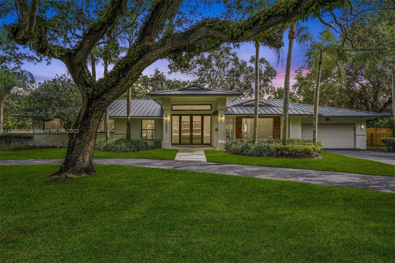 This one-story 4,233 sf Pinecrest residence is nestled on an impressive 37,897 sf lot with completely renovated 5 bedrooms and 3/1 bathrooms. The split floorplan features 2 master suites, spacious flow-through layout including foyer entry, formal living, family room, dining room, breakfast nook, with volume ceilings throughout. All new Kitchen with Bosch appliances overlooking the large covered patio, swimming pool with surrounding artificial turf, and additional expansive grounds and mature trees. New metal roof, impact windows and doors. 2 car garage. Great location – situated minutes from A+ rated schools, dining, and expressways.