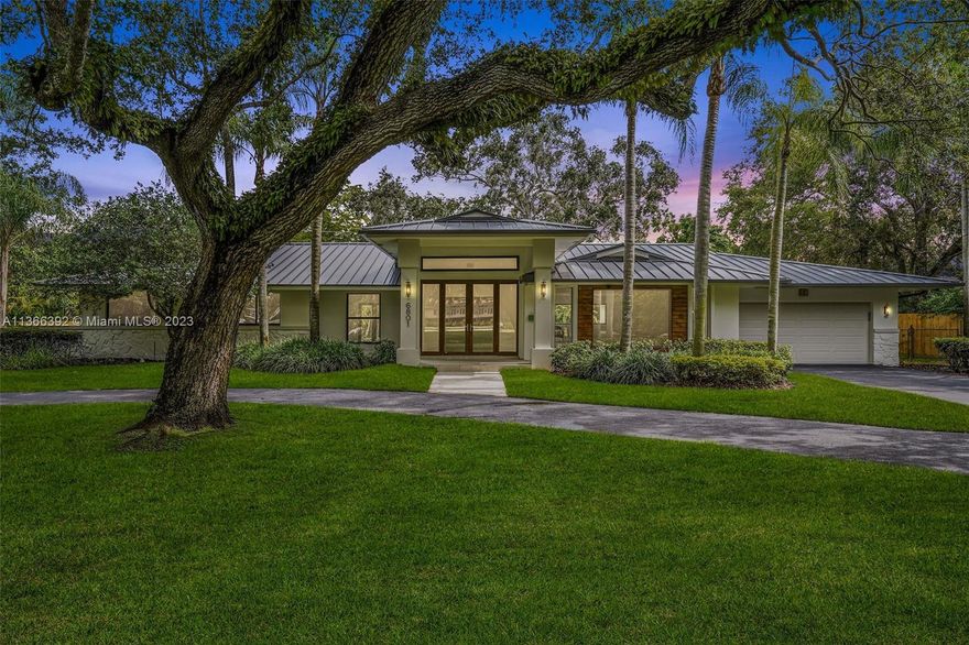 This one-story 4,233 sf Pinecrest residence is nestled on an impressive 37,897 sf lot with completely renovated 5 bedrooms and 3/1 bathrooms. The split floorplan features 2 master suites, spacious flow-through layout including foyer entry, formal living, family room, dining room, breakfast nook, with volume ceilings throughout. All new Kitchen with Bosch appliances overlooking the large covered patio, swimming pool with surrounding artificial turf, and additional expansive grounds and mature trees. New metal roof, impact windows and doors. 2 car garage. Great location – situated minutes from A+ rated schools, dining, and expressways.