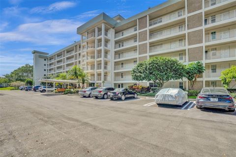 Photo of 3100 N Course Ln #108, Pompano Beach, FL 33069 (MLS # A11412028)