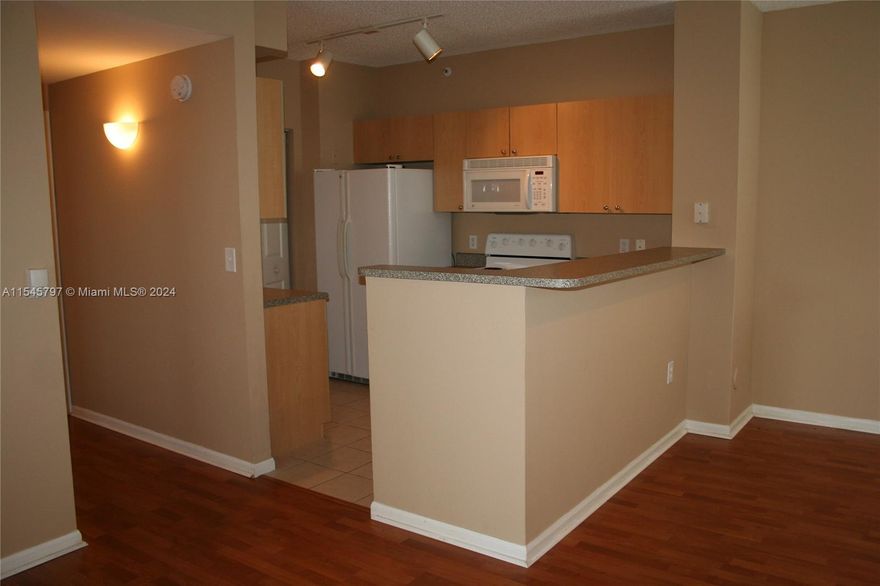 Gated community with awesome amenities offers this great first-floor apartment with hard floors, open living area, full size washer & dryer, spacious patio and smart floorplan with guest access to bath. Pretty, bright and spacious with excellent closet space. Florida Property Management residents are enrolled in a Resident Benefits Package for $60.00/mo - includes renter’s insurance, HVAC filter delivery, on-demand pest control, credit building, $1M Identity Protection, utility concierge, rewards program, and more! More details upon application.