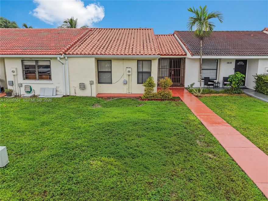 Excellent Location 3bd/2bath One-story Townhouse. Spacious, move in ready, and exceptionally well maintained. Bright open concept layout. Title flooring flows throught out the home, creating a clean and cohesive feel. Enjoy added peace of mind with impact windows and door hurrica shutters.  Major updates include A/C Unit (2027), Roof (2017) and tankless water heater.  Step outside to your private backyard featuring two separate covered patios.  Ideal for relaxing, entertainment or enjoying outdoor leaving all year around.  Excellent communites ammenites include pool, tennis courts.  Two assigned parking spaces and a low maintenance fee addeven more value.  Don't miss this opportunity to own this  wonderful townhouse.   Scheduled your showing today!