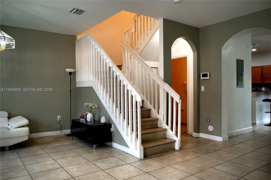 Beautifully maintained 3-bedroom, 2.5-bath two-story townhouse offered at a great price in desirable Bellagio Villas. Built in 2014, this 1,574 sq. ft. home features a bright open layout, tile flooring on the first floor, and laminate wood upstairs. The upgraded kitchen with stainless appliances flows to a private paved and fenced patio, perfect for relaxing or entertaining. The primary suite includes a private bathroom, while the additional bedrooms share a full bath. The washer and dryer add convenience, and impact windows provide extra security. Enjoy assigned parking spaces plus ample guest parking in this safely gated & walled, FHA-approved community with low maintenance fees. Resort-style amenities include a pool, clubhouse, fitness center, and playground. Just minutes from I-75, shopping, dining, and top-rated schools, this home is ideal for first-time buyers or investors.